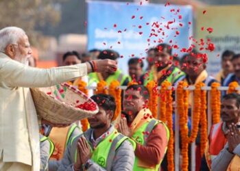 Modi showers flowers petals on Ram Temple
